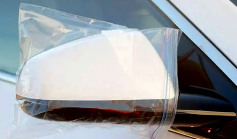 Ziplock bag on car mirror