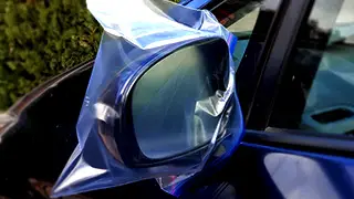 Ziplock bag on car mirror